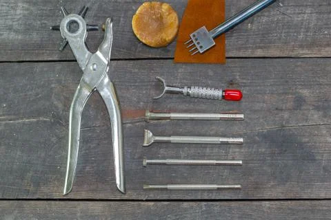 Leather instruments kit. Flat set. Old leather tooling stamps for handmade 写真素材