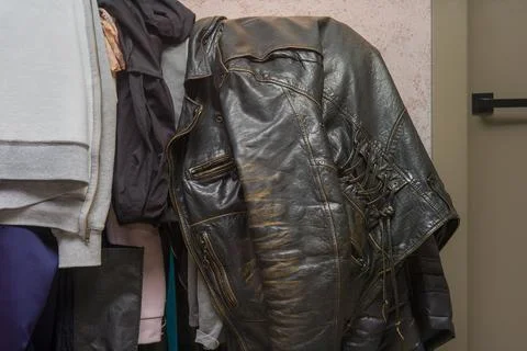 Leather jacket hanging on a rack Stockfoto's