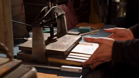 Leather master creating new piece of item. Stock Footage 83048657