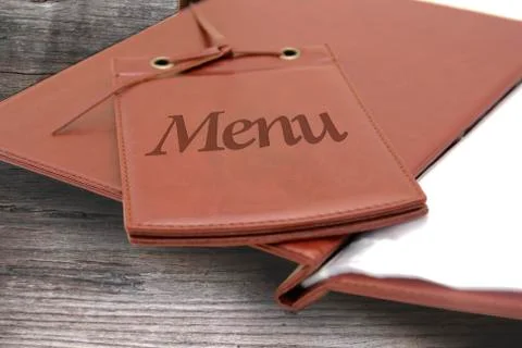 Leather menu in a restaurant Stock Photos
