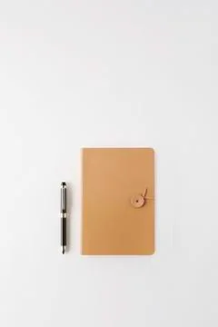 Leather note and pen Stock Photos