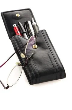 Leather notebook and glasses isolated on white background Stock Photos
