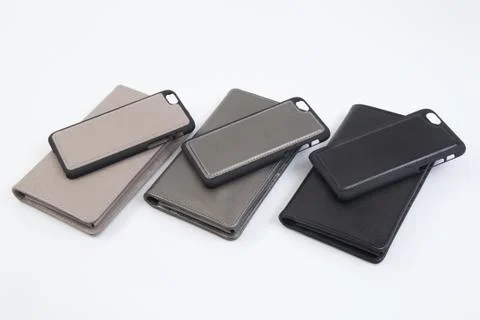 Leather phone case craftsmanship work on the white background. Stock Photos