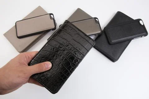 Leather phone case craftsmanship work on the white background. Foto stock
