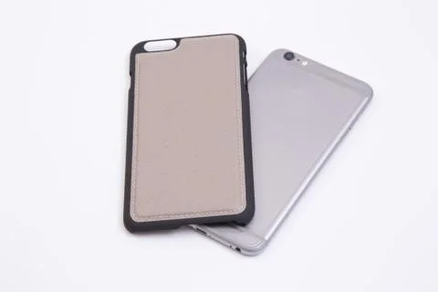 Leather phone case craftsmanship work on the white background. Stock Photos