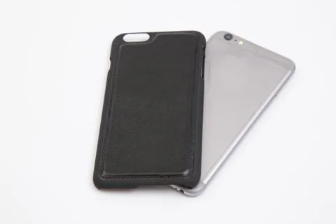 Leather phone case craftsmanship work on the white background. Stock Photos