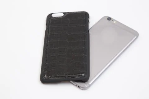 Leather phone case craftsmanship work on the white background. Stock Photos