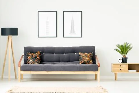 Leather pillows on dark couch Stock Photos