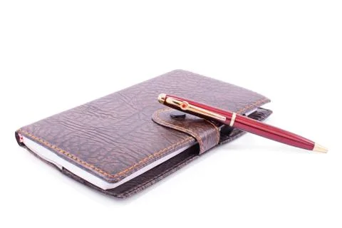 Leather planner notebook with a pen Stock Photos