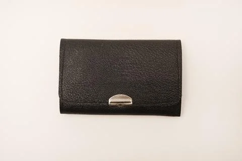 A leather purse with a screwdriver and bits. A set of different screwdrivers. Stock Photos