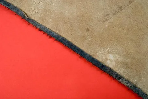 Leather on red paper Stock Photos