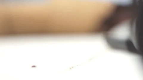 Leather rolled into a roll unfolds on the table. Close-up Stock Footage 104925335