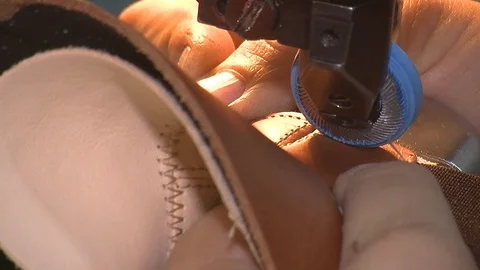 Leather sewing with a sewing machine.The Process Of Making Shoes Stock Footage 90273846