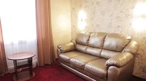 Leather sofa table chair red carpet in a hotel room Stock Footage 55617430