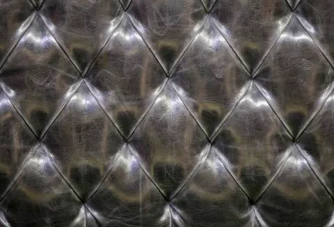 Leather sofa texture background. ?he black gray quilted leather pattern. Leat Stock Photos