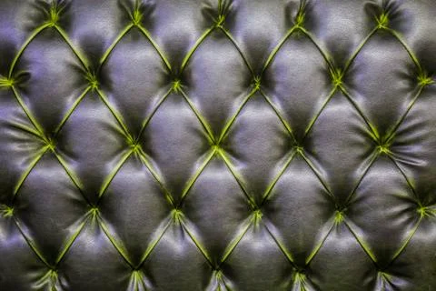 Leather sofa texture background. ?he black gray quilted modern leather patter Stock Photos