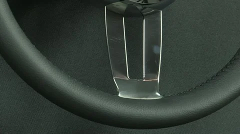 Leather steering wheel on black background Stock Footage 22413871