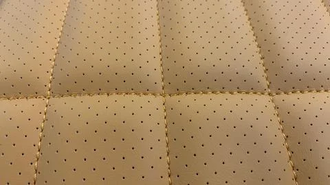 Leather stitched and perforated with pattern, leather orange texture Stock Photos