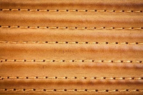 Leather stitched by threads Stock Photos