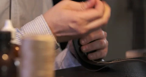 Leather Stitching. Men in Dark Workshop Makes Leather Wallet. Expensive Product Stock Footage 148199481