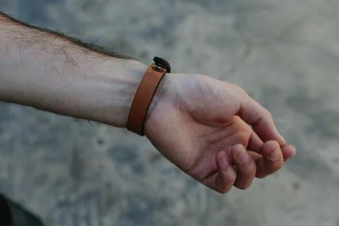 Leather strap on the arm Stock Photos
