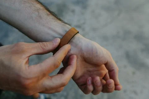 Leather strap on the arm Stock Photos