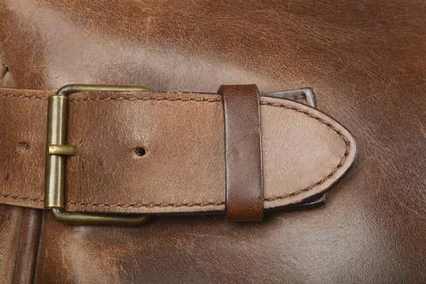 Leather strap with a brass buckle Stock Photos