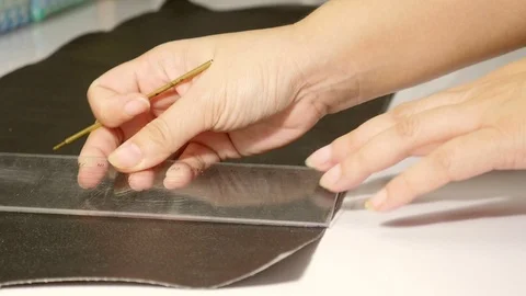 Leather tailor is working with her handmade product Video stock 101035488