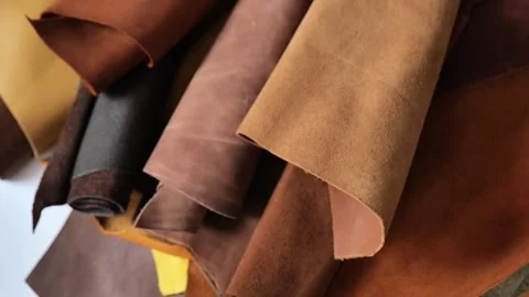 Leather texture backdrop  with soft folds. Warm earthy tones Stock Footage 333861489