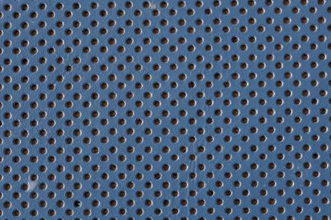 Leather texture as background. Grained, punctured texture closeup. Stock Photos