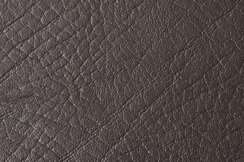 Leather texture as background. Grained, texture closeup. Stock-Fotos