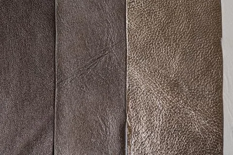 Leather texture as background. Grained, texture closeup. Stock Photos
