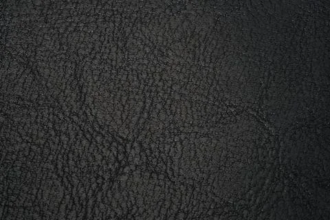 Leather texture black background. texture of genuine leather. Stock Photos