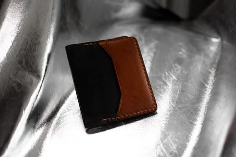Leather wallet brown on a silver background Stock Photos
