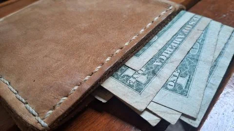 Leather wallet with dollar bills inside. Business and finance concept for money Stock Photos