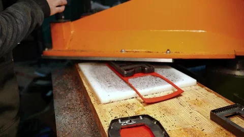 Leather wallet shape cut with metal die press in workshop Stock Footage 312258863