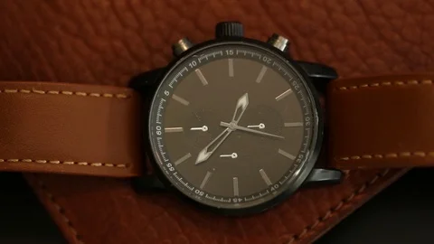 Leather watch top down view in slow motion Stock Footage 88704184
