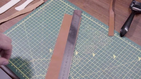 Leather working workshop, man cut leather 스톡 동영상 132341195