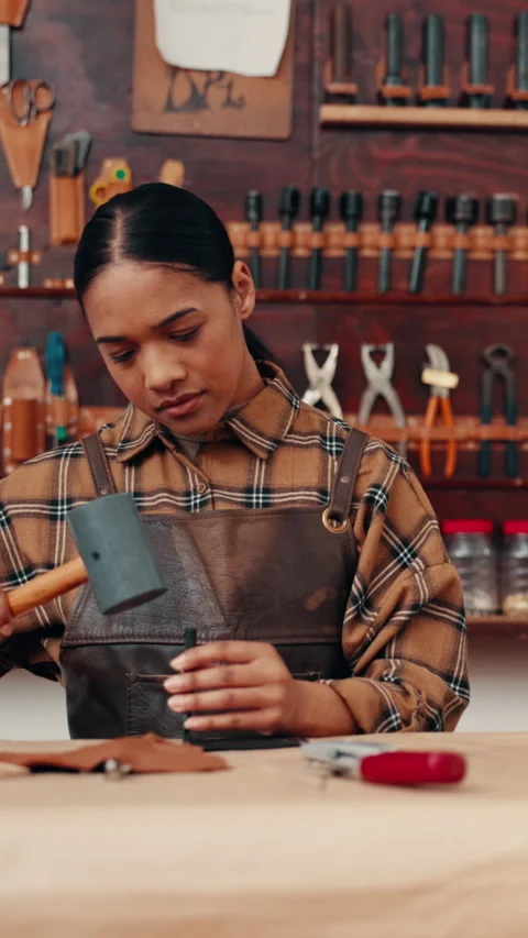 Leather workshop, woman and tools with craft, manufacturing and unique textile Stock Footage 332892332