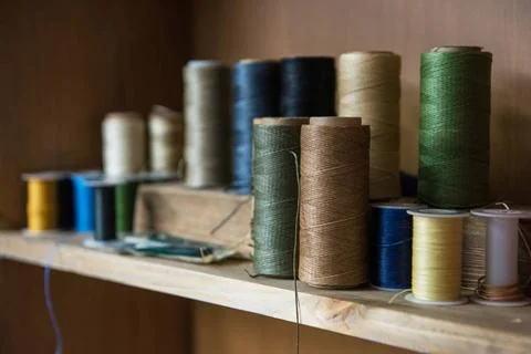 Leathermaker s work desk Sewing thread for leather goods. ,model released,... Stock Photos