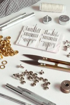 Leatherworking tools and hardware installation on light background Stock Photos