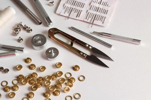 Leatherworking tools and hardware installation on light background Stock Photos