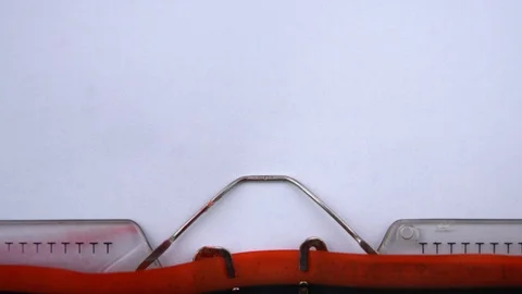 Leave a comment - phrase printed on an old typewriter in red letters, close up. Stock-Footage 126777551