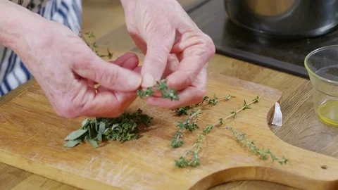 Leaves being stripped off thyme stems Video stock 84554705