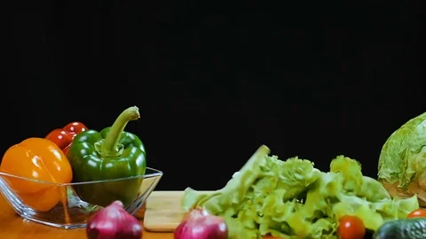 Leaves of lettuce fall on the table. Stock Footage 75959548