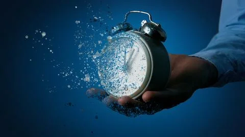 Leaving concept, clock breaks into pieces 库存照片