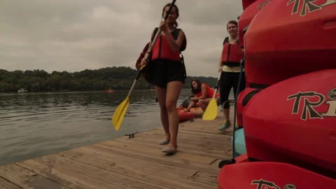 Leaving kayaks at the dock Stock Footage 145737586