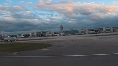 Leaving the Magic City: 4K Airplane Window View of Miami International Airport Stock Footage 332163387