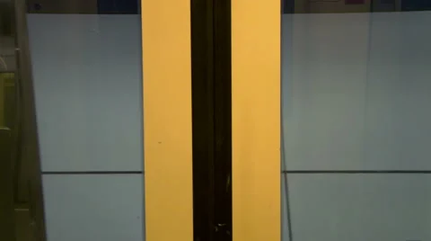 Leaving metro station seen through train door window. People commuting. Flashing Stock Footage 42490952
