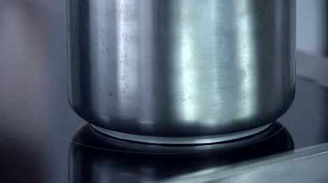 Leaving the silver pot on the induction cooker Stock Footage 37164213